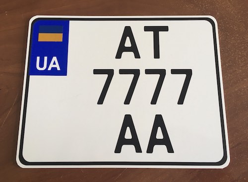 License plates for a motorcycle with a blue flag on plastic    